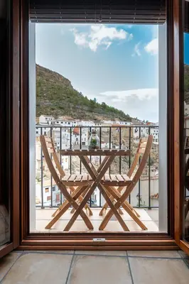 a view of a table and chairs from a window at Casa Rural La Corretger in Chulilla