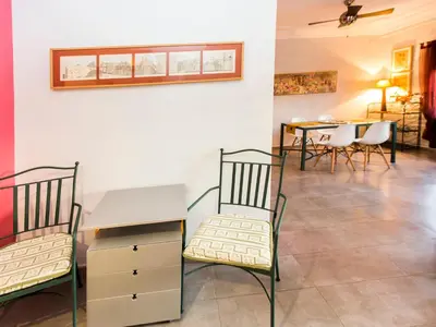 a room with two chairs and a desk and a table at Total Valencia El Carmen (Leisure & Culture) in Valencia