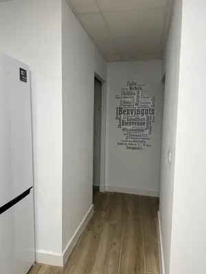 a hallway with a wall with a painting on the wall at Apartamento Valencia 17 in Paiporta