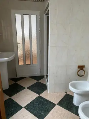 a bathroom with a toilet and a sink and a door at MAR i MONTAÑA en Cullera Villa Juani in Cullera