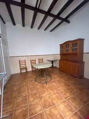 a room with a table and chairs in a room at MAR i MONTAÑA en Cullera Villa Juani in Cullera