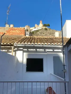 a view of a white house with a roof at MAR i MONTAÑA en Cullera Villa Juani in Cullera