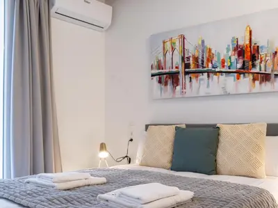 a bedroom with a bed with a painting on the wall at Central Market - Ciutat Vella, exclusively for families - Mid-term in Valencia