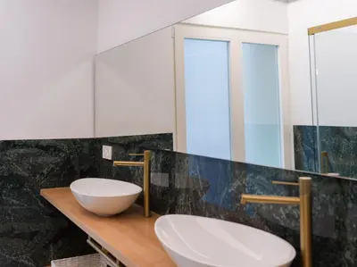 a bathroom with two sinks on a wooden counter at Central Market - Ciutat Vella, exclusively for families - Mid-term in Valencia