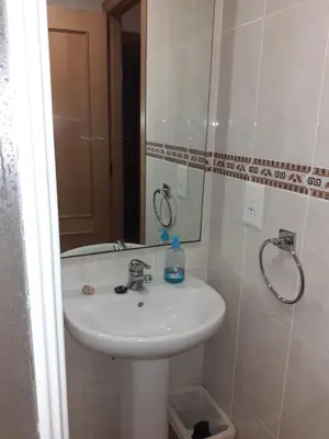 a bathroom with a sink and a mirror at Amanecer marino, solo a 5 minutos andando de la playa in Puzol
