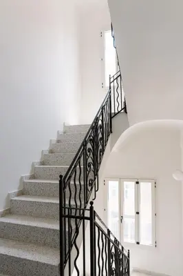 a set of stairs with wrought iron railings at La Alfarería in Valencia