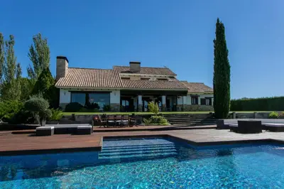 a house with a swimming pool in front of a house at La Traviesa,Villa de Lujo de 500 m. en el Campo con Piscina in Campo Arcís