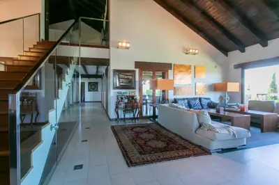 a living room with a couch and a table at La Traviesa,Villa de Lujo de 500 m. en el Campo con Piscina in Campo Arcís