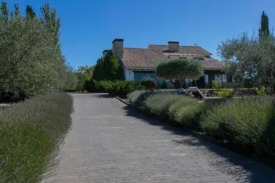a brick path in front of a house at La Traviesa,Villa de Lujo de 500 m. en el Campo con Piscina in Campo Arcís