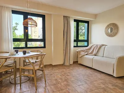 a living room with a couch and a table at Apartamentos Las Ciencias Studio Q in Valencia