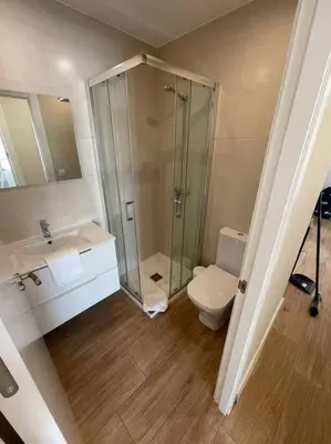 a bathroom with a shower and a toilet and a sink at Apartamento WELCOME céntrico de diseño en calle Tres Forques in Valencia