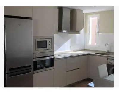 a kitchen with a stainless steel oven and appliances at Apartamento WELCOME céntrico de diseño en calle Tres Forques in Valencia