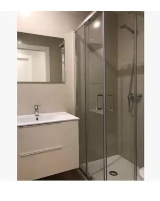 a bathroom with a glass shower and a sink at Apartamento WELCOME céntrico de diseño en calle Tres Forques in Valencia