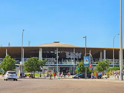 a large building with people walking in front of it at Apartamentos Las Ciencias R in Valencia