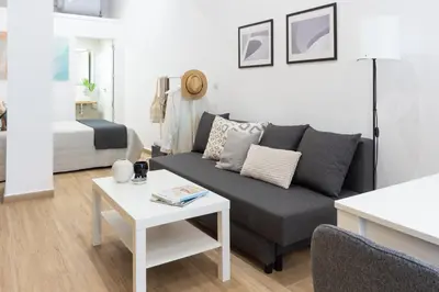 a living room with a couch and a bed at VLC HOST- Fray Pedro in Valencia