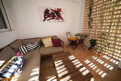a living room with a couch and a table at Casa Ross en Ruzafa in Valencia