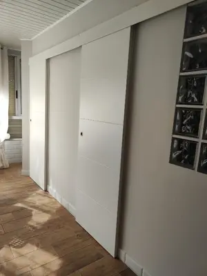 a sliding door in a room with white walls at Apartament CullerA in Cullera