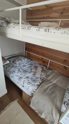a couple of bunk beds in a room at Apartament CullerA in Cullera