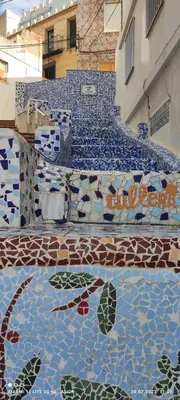 a set of stairs with mosaics on the floor at Apartament CullerA in Cullera