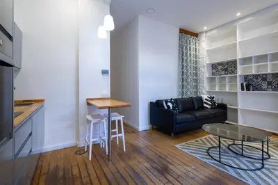 a living room with a couch and a table at FLORIT FLATS - The Vella Apartment in Valencia