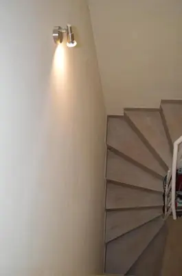 a room with a staircase with a light on the wall at Barraca Beach in Valencia