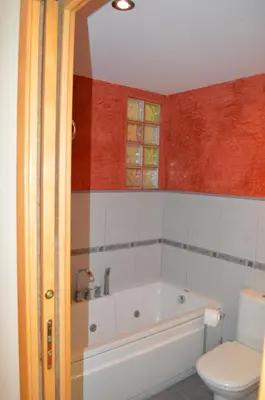 a bathroom with a tub and a toilet at Barraca Beach in Valencia