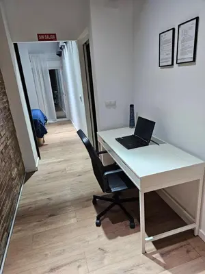 a white desk with a laptop on it in an office at Bear Homes - Olimpia Suite in Valencia