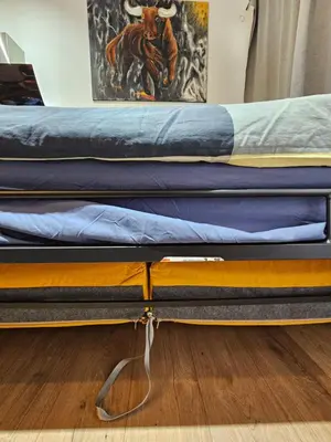 a bed with two mattresses on top of it at Bear Homes - Olimpia Suite in Valencia