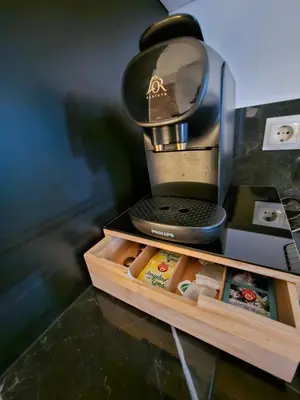 a coffee maker sitting on top of a table at Bear Homes - Olimpia Suite in Valencia