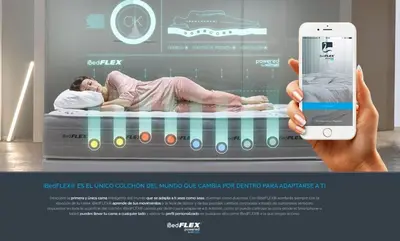 a person holding up a cell phone in front of a bed at Bear Homes - Olimpia Suite in Valencia