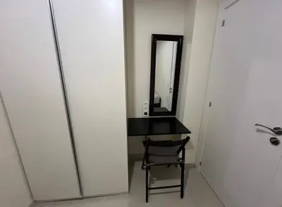 a bathroom with a black desk and a mirror at Modern apartment in heart of city in Valencia