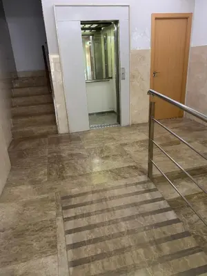 an empty hallway with stairs and a mirror at Modern apartment in heart of city in Valencia