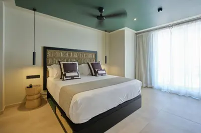 a bedroom with a large bed with two pillows on it at ESTIMAR Marina Farnals in Puebla de Farnals
