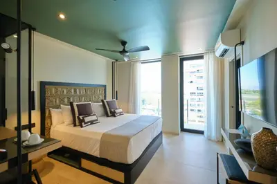 a bedroom with a large bed and a large window at ESTIMAR Marina Farnals in Puebla de Farnals