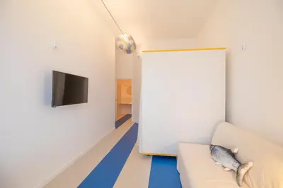 a living room with a couch and a tv at Marino by Concept in Valencia
