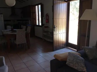 a living room with a couch and a table at El Pino B & B, Chera in Valencia