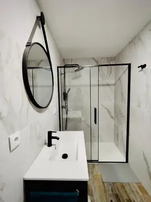 a bathroom with a sink and a shower at Casa Rural Sarsalet in Chella