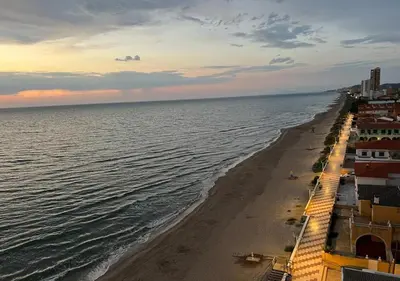 a view of a beach with buildings and the ocean at Apartamento Rey I in Valencia