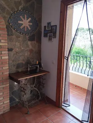 a bathroom with a sink and a stone wall at RuralRusticHome in Altura