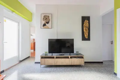 a living room with a flat screen tv on a wall at Casa con terraza en Sierra de Espadán in Vall de Uixó