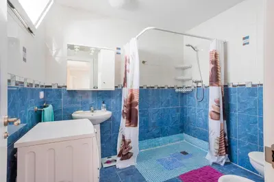 a bathroom with a shower and a toilet and a sink at Casa con terraza en Sierra de Espadán in Vall de Uixó