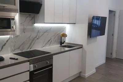 a kitchen with a sink and a counter top at Apartamento 4 habitaciones 2 baños Ciudad de las Ciencias VT-55209-V in Valencia