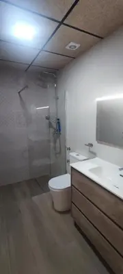 a bathroom with a shower and a toilet and a sink at Apartamento 4 habitaciones 2 baños Ciudad de las Ciencias VT-55209-V in Valencia