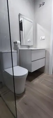 a bathroom with a white toilet and a mirror at Apartamento 4 habitaciones 2 baños Ciudad de las Ciencias VT-55209-V in Valencia
