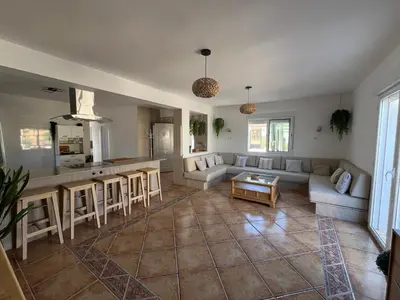 a living room with a couch and a table at Casa de campo Ismael in Siete Aguas