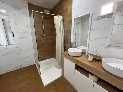 a bathroom with a glass shower and a sink at Casa de campo Ismael in Siete Aguas