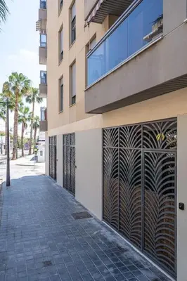 a building with aicked walkway in front of a building at Fantastic Loft with an exquisite design in Valencia