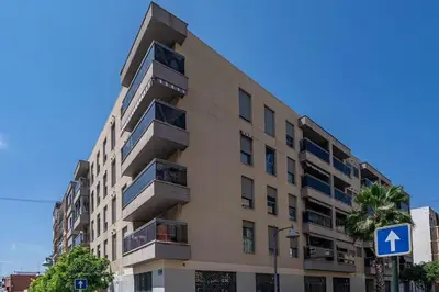 a tall building with an arrow sign in front of it at Fantastic Loft with an exquisite design in Valencia