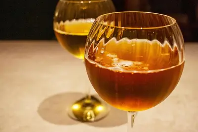 two glasses of wine sitting on a table at La Novieta Boutique Hotel - Adults Only in Valencia