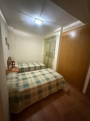 a white table and chairs on a balcony at Duplex en Navajas (Castellón) in Navajas